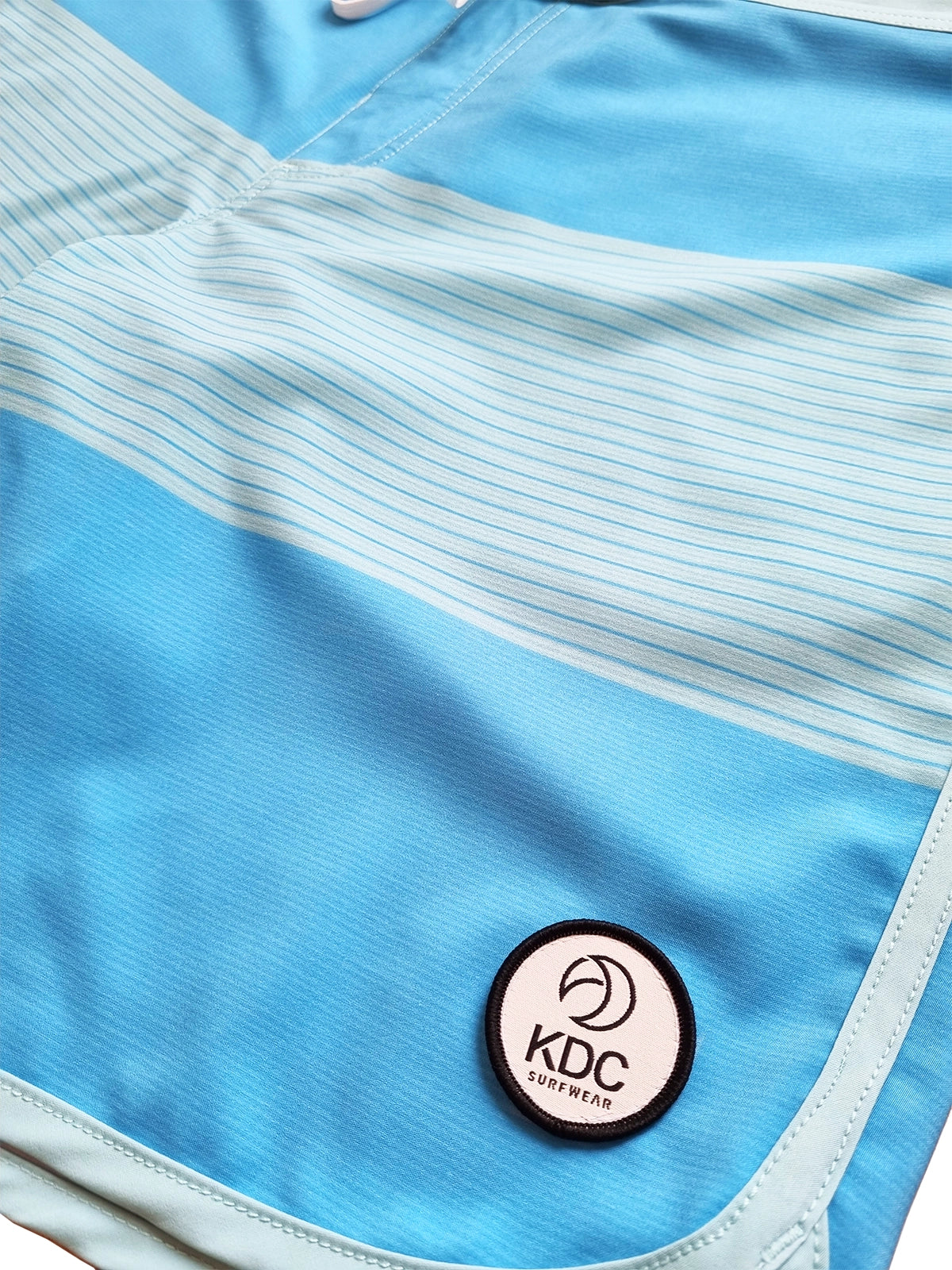 Boardshort surf theos logo